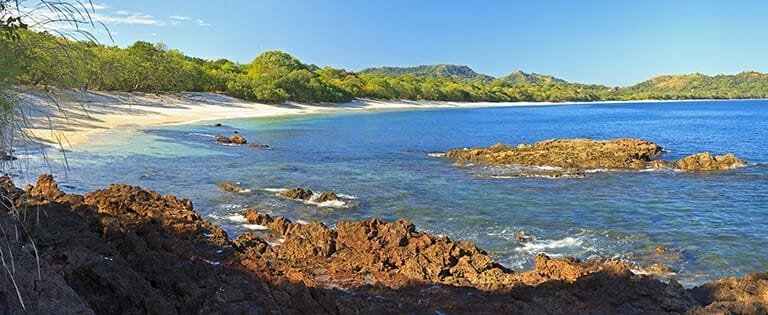 Panorama of quiet, beautiful Playa Conchal and the azure waters of the Pacific Ocean in Guanacaste, Costa RIca